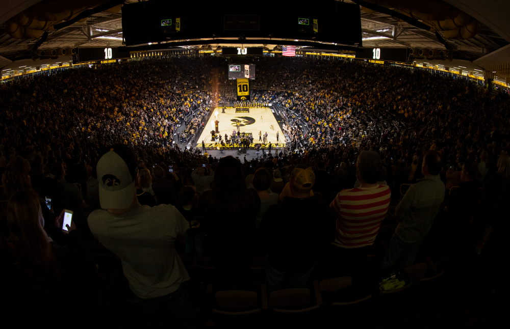 Megan Gustafson stands with her family as her number is raised into the rafters during a jersey retirement ceremony Sunday, January 26, 2020 at Carver-Hawkeye Arena. (Brian Ray/hawkeyesports.com)