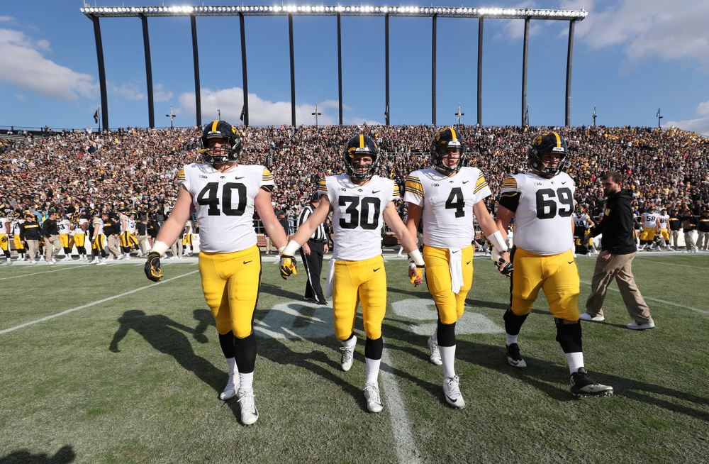 Iowa Hawkeyes captains defensive end Parker Hesse (40), defensive back Jake Gervase (30), quarterback Nate Stanley (4), and offensive lineman Keegan Render (69) against the Purdue Boilermakers Saturday, November 3, 2018 Ross Ade Stadium in West Lafayette, Ind. (Brian Ray/hawkeyesports.com)