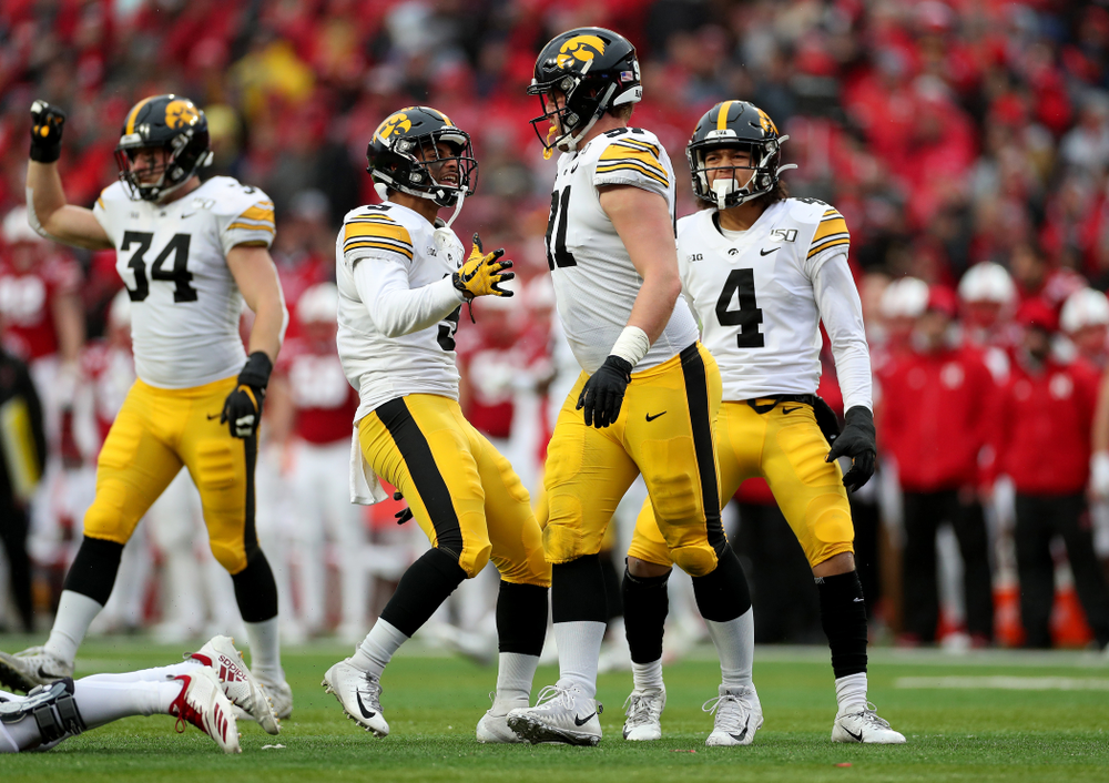 Iowa Hawkeyes defensive back Geno Stone (9) and defensive lineman Brady Reiff (91) against the Nebraska Cornhuskers Friday, November 29, 2019 at Memorial Stadium in Lincoln, Neb. (Brian Ray/hawkeyesports.com)