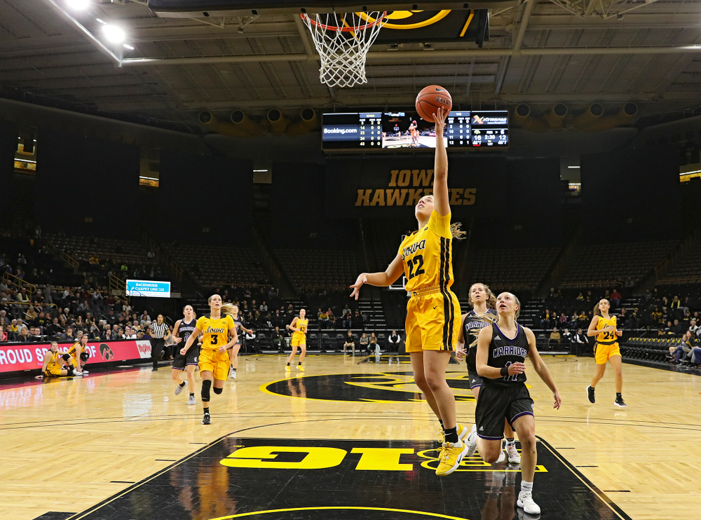 Iowa guard Kathleen Doyle (22) makes a basket during the first quarter of their game against Winona State at Carver-Hawkeye Arena in Iowa City on Sunday, Nov 3, 2019. (Stephen Mally/hawkeyesports.com)