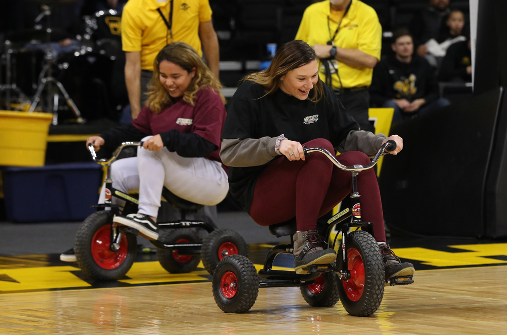 Fans race tricycles on the court during the Iowa Hawkeyes game against the Rutgers Scarlet Knights Wednesday, January 23, 2019 at Carver-Hawkeye Arena. (Brian Ray/hawkeyesports.com)
