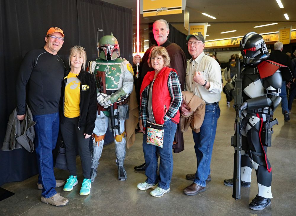 Iowa Hawkeyes fan pose with Star Wars characters on the concourse before the game at Carver-Hawkeye Arena in Iowa City on Sunday, December 29, 2019. (Stephen Mally/hawkeyesports.com)