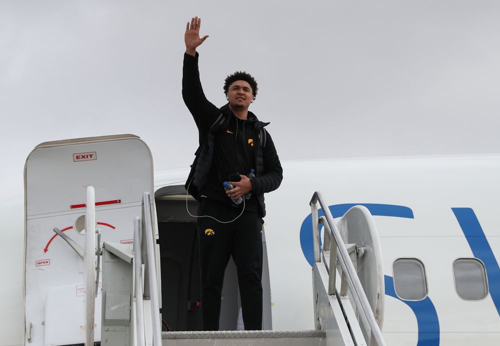 Iowa Hawkeyes forward Cordell Pemsl (35) boards a flight to Columbus for the first and second rounds of the 2019 NCAA Men's Basketball Tournament Wednesday, March 20, 2019 at the Eastern Iowa Airport. (Brian Ray/hawkeyesports.com)