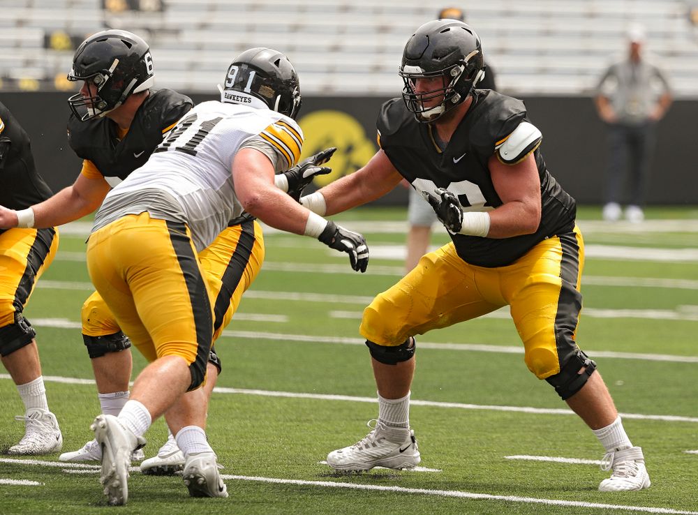 Iowa Hawkeyes offensive lineman Landan Paulsen (right) looks to block defensive lineman Brady Reiff (91) during Fall Camp Practice No. 8 at Kids Day at Kinnick Stadium in Iowa City on Saturday, Aug 10, 2019. (Stephen Mally/hawkeyesports.com)