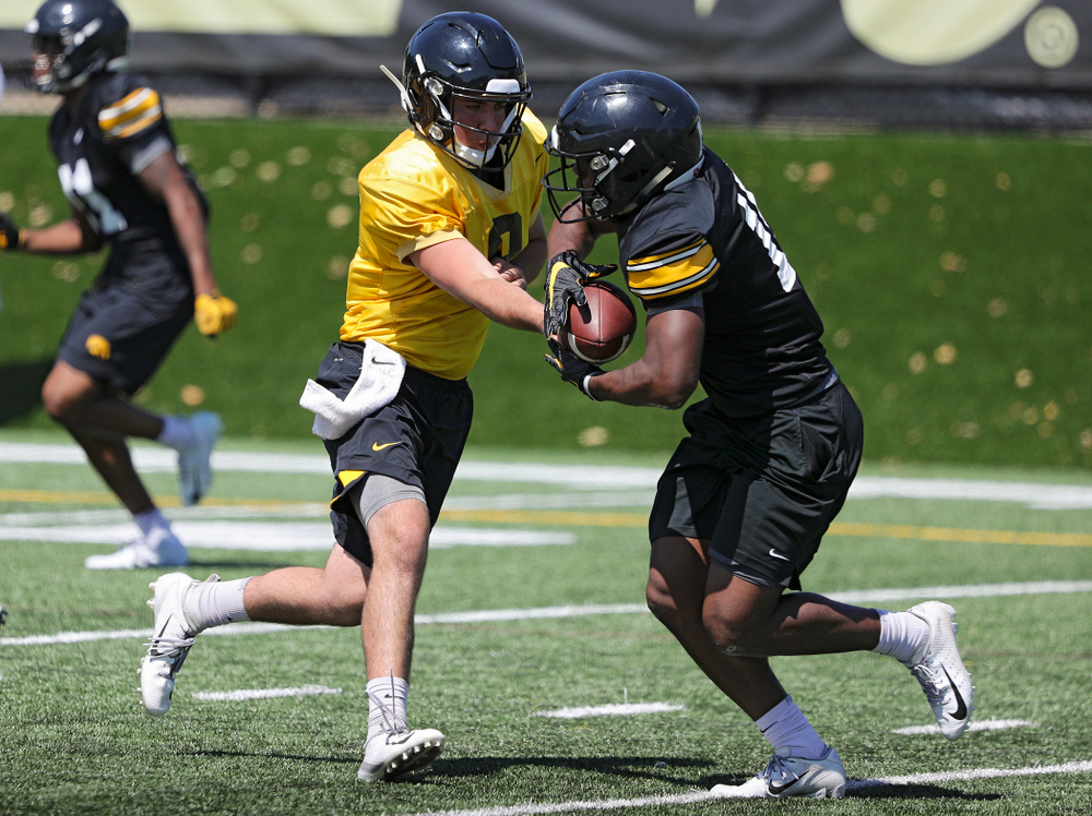 Iowa Hawkeyes quarterback Alex Padilla (8) hands the ball off to running back Tyler Goodson (15) during Fall Camp Practice No. 7 at the Hansen Football Performance Center in Iowa City on Friday, Aug 9, 2019. (Stephen Mally/hawkeyesports.com)
