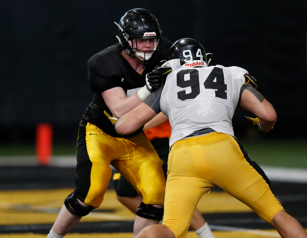 Iowa Hawkeyes defensive end A.J. Epenesa (94) and offensive lineman Mark Kallenberger (71) during spring practice Wednesday, March 28, 2018 at the Hansen Football Performance Center. (Brian Ray/hawkeyesports.com)