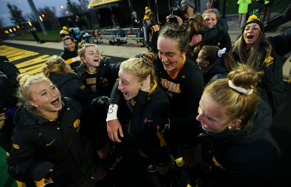 Members of the Iowa Hawkeyes field hockey team celebrate after a 3-2 win against No. 6 Penn State at Grant Field on October 12, 2018. (Tork Mason/hawkeyesports.com)