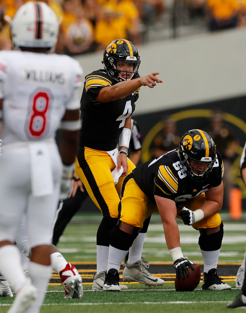 Iowa Hawkeyes quarterback Nate Stanley (4) and offensive lineman Keegan Render (69) against the Northern Illinois Huskies Saturday, September 1, 2018 at Kinnick Stadium. (Brian Ray/hawkeyesports.com)