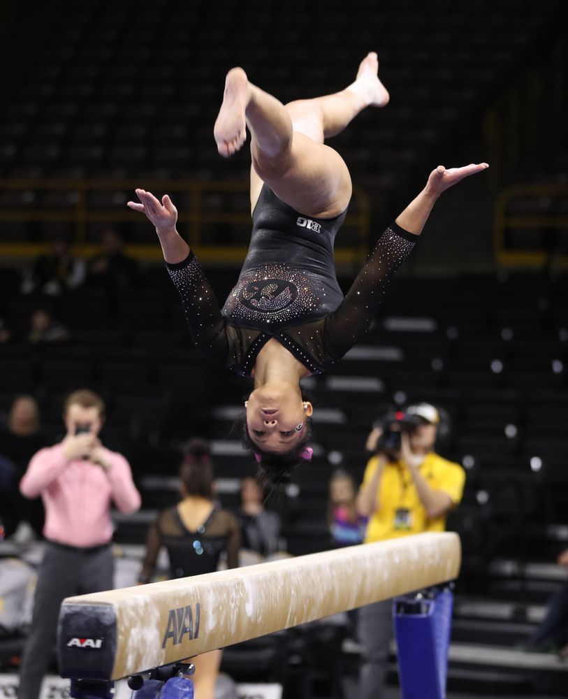 Iowa's Lauren Guerin competes on the bars during their meet against the Minnesota Golden Gophers Saturday, January 19, 2019 at Carver-Hawkeye Arena. (Brian Ray/hawkeyesports.com)