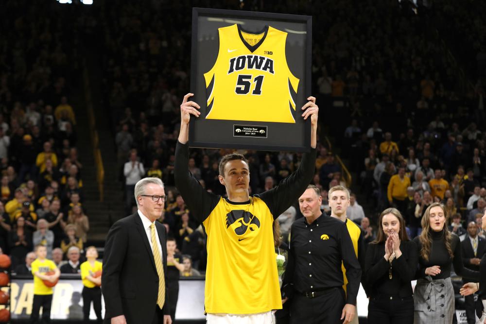 Iowa Hawkeyes forward Nicholas Baer (51) holds up his frames jersey during senior day activities before their game against the Rutgers Scarlet Knights Saturday, March 2, 2019 at Carver-Hawkeye Arena. (Brian Ray/hawkeyesports.com)