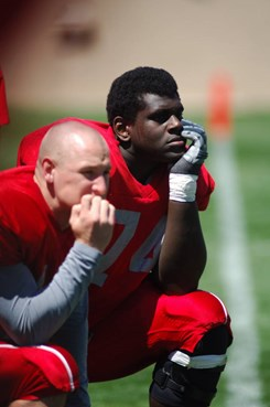 Byron Bell and Brad Gruner watch the scrimmage late in the fourth quarter.