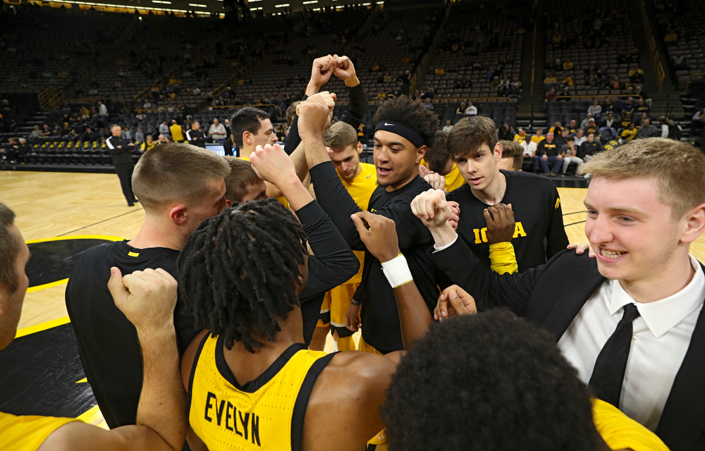 The Iowa Hawkeyes huddle before their game at Carver-Hawkeye Arena in Iowa City on Monday, Nov 11, 2019. (Stephen Mally/hawkeyesports.com)