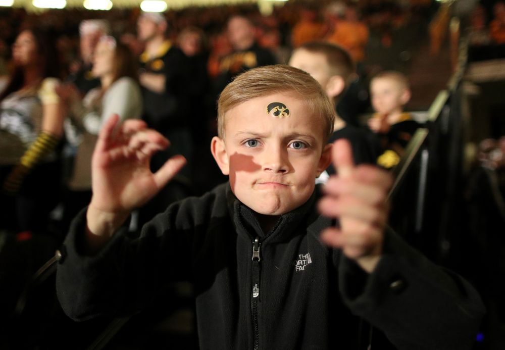 A young fan cheers on the Hawkeyes as they wrestle Nebraska Saturday, January 18, 2020 at Carver-Hawkeye Arena. (Brian Ray/hawkeyesports.com)