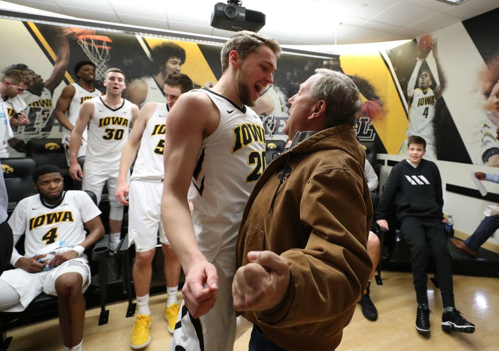 wa Hawkeyes forward Riley Till (20) chest bumps University of Iowa President Bruce Harreld following their victory over the Northwestern Wildcats Sunday, February 10, 2019 at Carver-Hawkeye Arena. (Brian Ray/hawkeyesports.com)