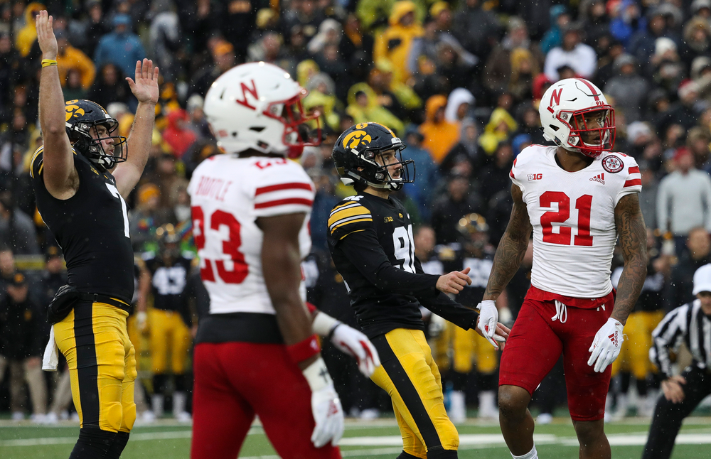 Iowa Hawkeyes punter Colten Rastetter (7) and Iowa Hawkeyes placekicker Miguel Recinos (91) watch as Recinos' game-winning 41-yard field goal as time expires during a game against Nebraska at Kinnick Stadium on November 23, 2018. (Tork Mason/hawkeyesports.com)