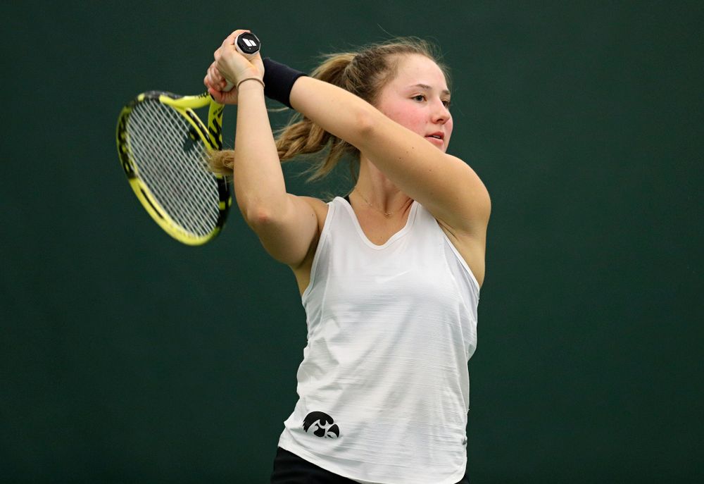 Iowa’s Danielle Burich returns a shot during her singles match at the Hawkeye Tennis and Recreation Complex in Iowa City on Sunday, February 23, 2020. (Stephen Mally/hawkeyesports.com)