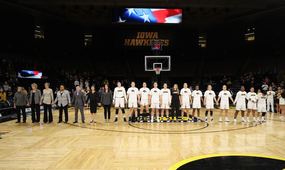 The Iowa Hawkeyes stand for the National Anthem before their game against the Wisconsin Badgers Monday, January 7, 2019 at Carver-Hawkeye Arena. (Brian Ray/hawkeyesports.com)