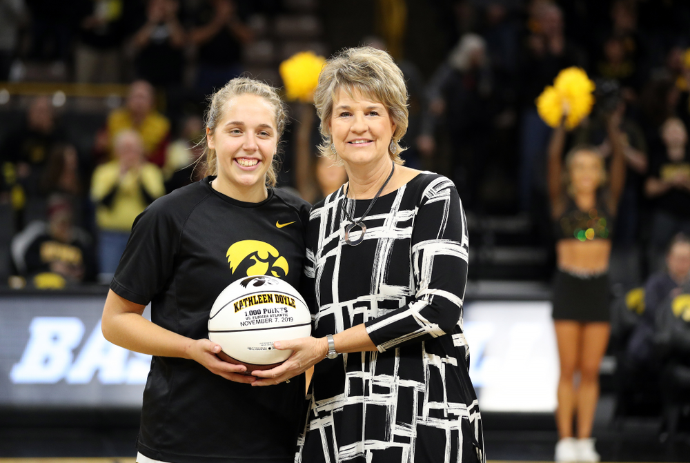 Iowa Hawkeyes guard Kathleen Doyle (22) receives a commemorative ball from Iowa Hawkeyes head coach Lisa Bluder before their game against North Alabama Thursday, November 14, 2019 at Carver-Hawkeye Arena. (Brian Ray/hawkeyesports.com)