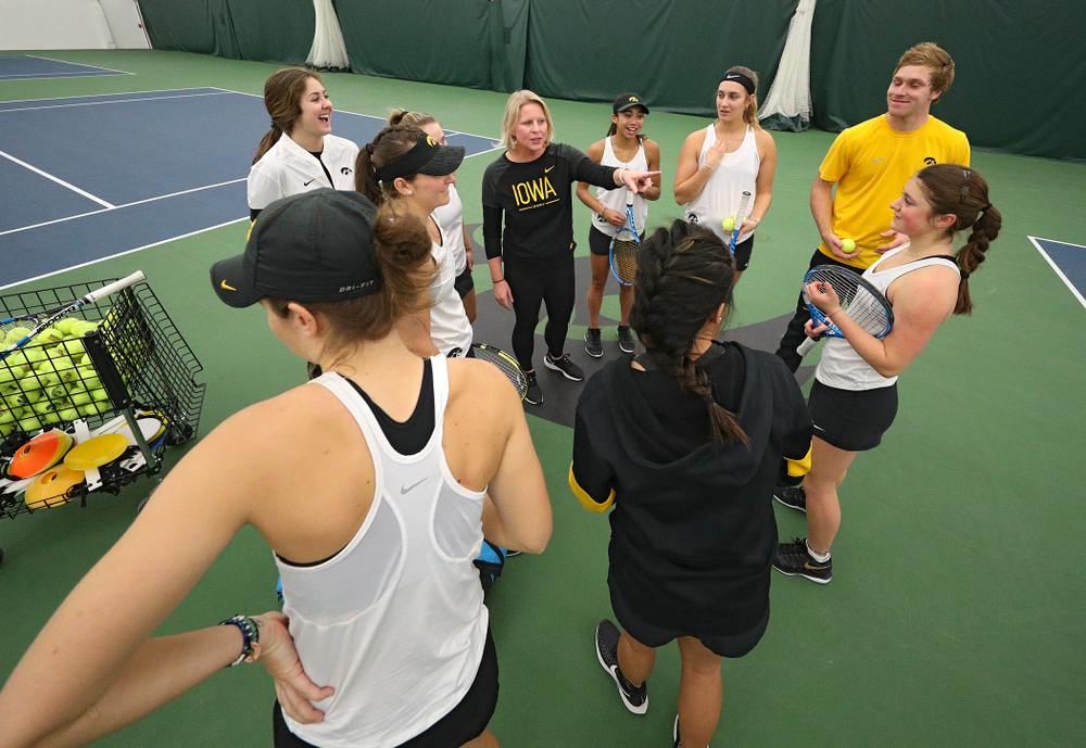 Iowa head coach Sasha Schmid talks to her team before their match at the Hawkeye Tennis and Recreation Complex in Iowa City on Sunday, February 23, 2020. (Stephen Mally/hawkeyesports.com)