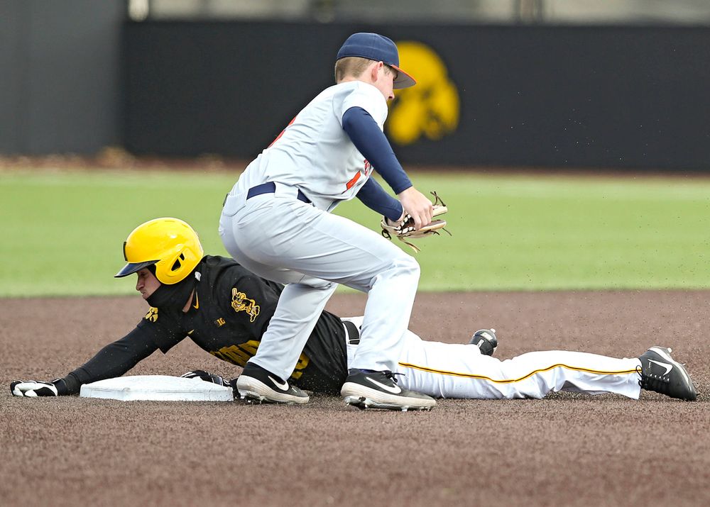Iowa Hawkeyes shortstop Tanner Wetrich (16) steals second base during the sixth inning of their game against Illinois at Duane Banks Field in Iowa City on Saturday, Mar. 30, 2019. (Stephen Mally/hawkeyesports.com)