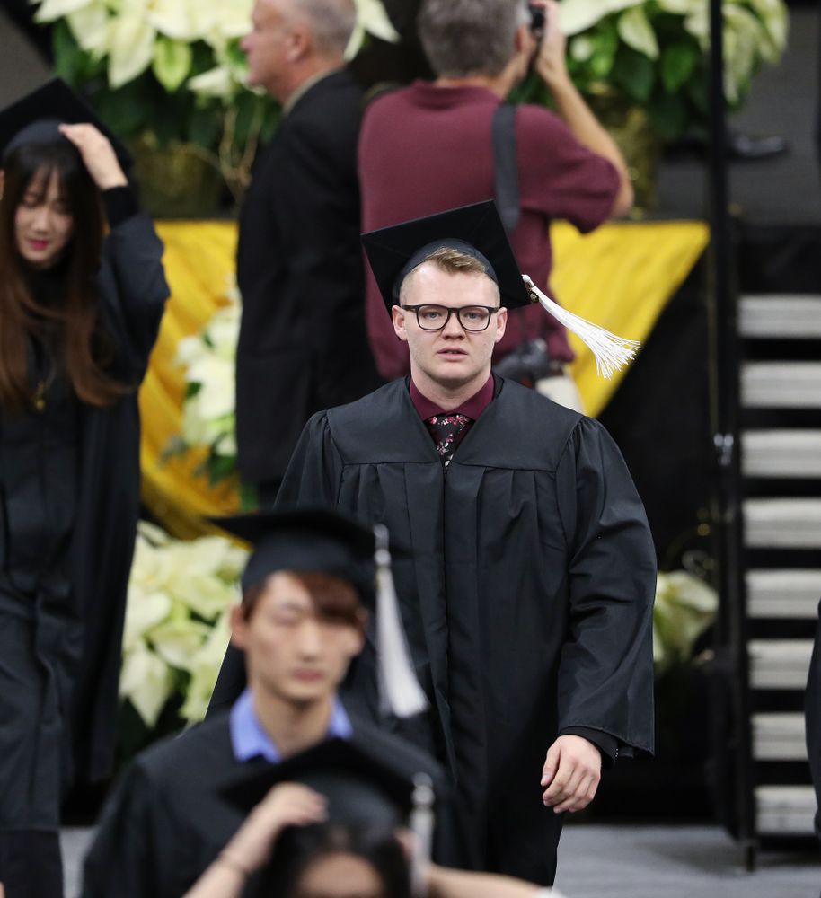 Iowa Men's Basketball manager Lucas Pauley during the Fall Commencement Ceremony Saturday, December 15, 2018 at Carver-Hawkeye Arena. (Brian Ray/hawkeyesports.com)