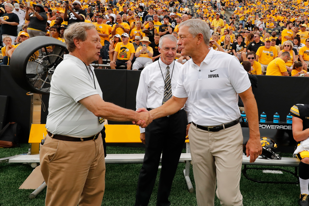Iowa Hawkeyes head coach Kirk Ferentz talks with University of Iowa President Bruce Harreld and athletics director Gary Barta before their game against the Northern Illinois Huskies Saturday, September 1, 2018 at Kinnick Stadium. (Brian Ray/hawkeyesports.com)