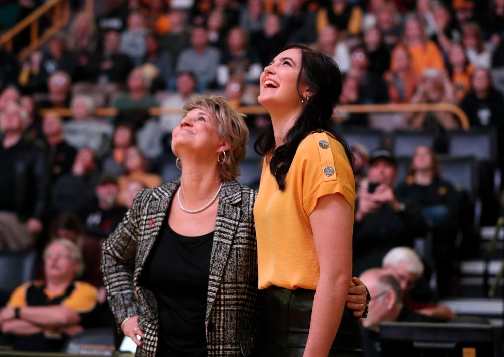 Megan Gustafson watches a video with head coach Lisa Bluder during a jersey retirement ceremony Sunday, January 26, 2020 at Carver-Hawkeye Arena. (Brian Ray/hawkeyesports.com)