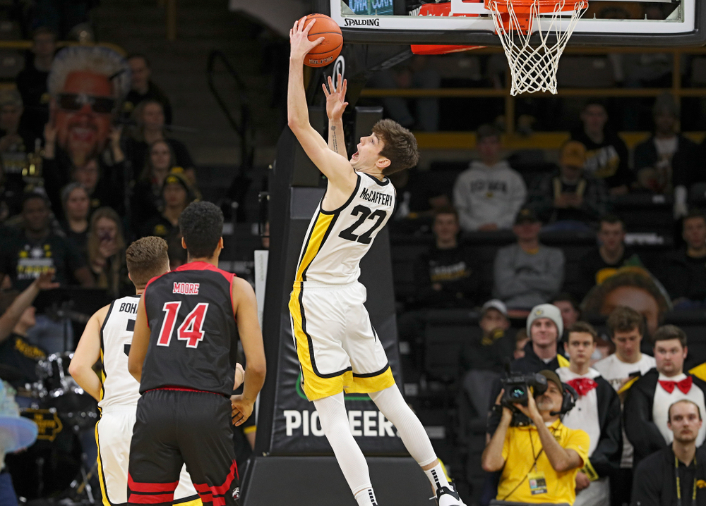 Iowa Hawkeyes forward Patrick McCaffery (22) pulls down a rebound during the second half of their game at Carver-Hawkeye Arena in Iowa City on Friday, Nov 8, 2019. (Stephen Mally/hawkeyesports.com)