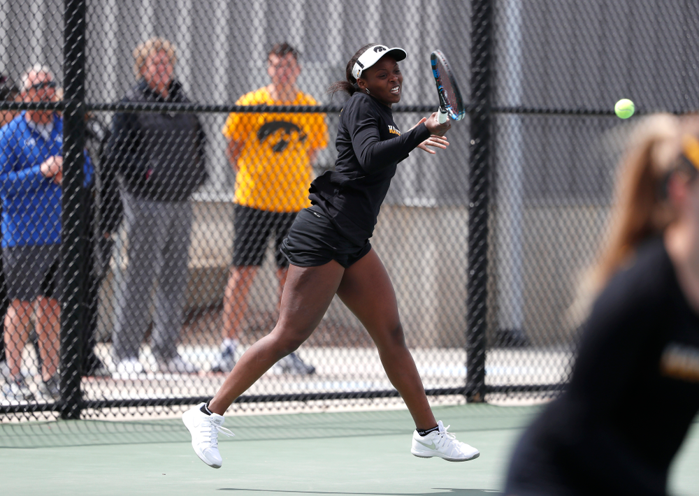 Adorabol Huckleby and Zoe Douglas play a doubles match against the Wisconsin Badgers Sunday, April 22, 2018 at the Hawkeye Tennis and Recreation Center. (Brian Ray/hawkeyesports.com)