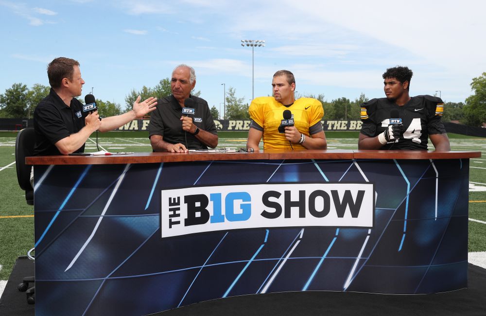 Iowa Hawkeyes quarterback Nate Stanley (4) and offensive lineman Tristan Wirfs (74) on the set of the BTN Tailgate Tour following fall camp Practice No. 16 Tuesday, August 20, 2019 at the Ronald D. and Margaret L. Kenyon Football Practice Facility. (Brian Ray/hawkeyesports.com)