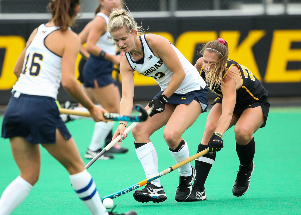 Iowa Hawkeyes midfielder Sophie Sunderland (20) defends during a game against Michigan at Grant Field on October 5, 2018. (Tork Mason/hawkeyesports.com)