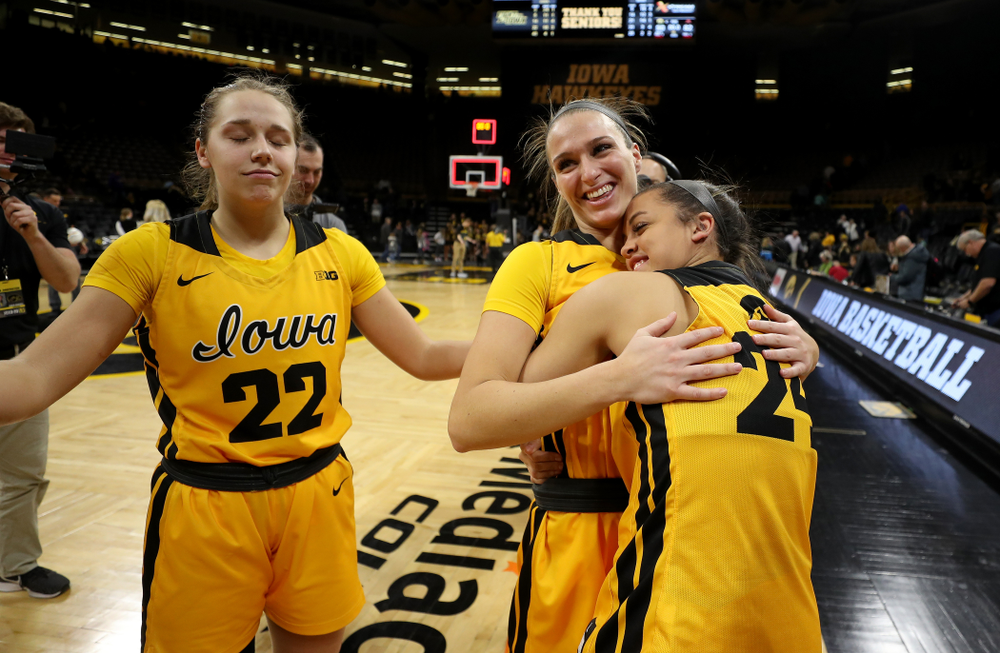 Iowa Hawkeyes guard Gabbie Marshall (24) with guard Makenzie Meyer (3) and guard Kathleen Doyle (22) during senior day activities following their win over the Minnesota Golden Gophers Thursday, February 27, 2020 at Carver-Hawkeye Arena. (Brian Ray/hawkeyesports.com)