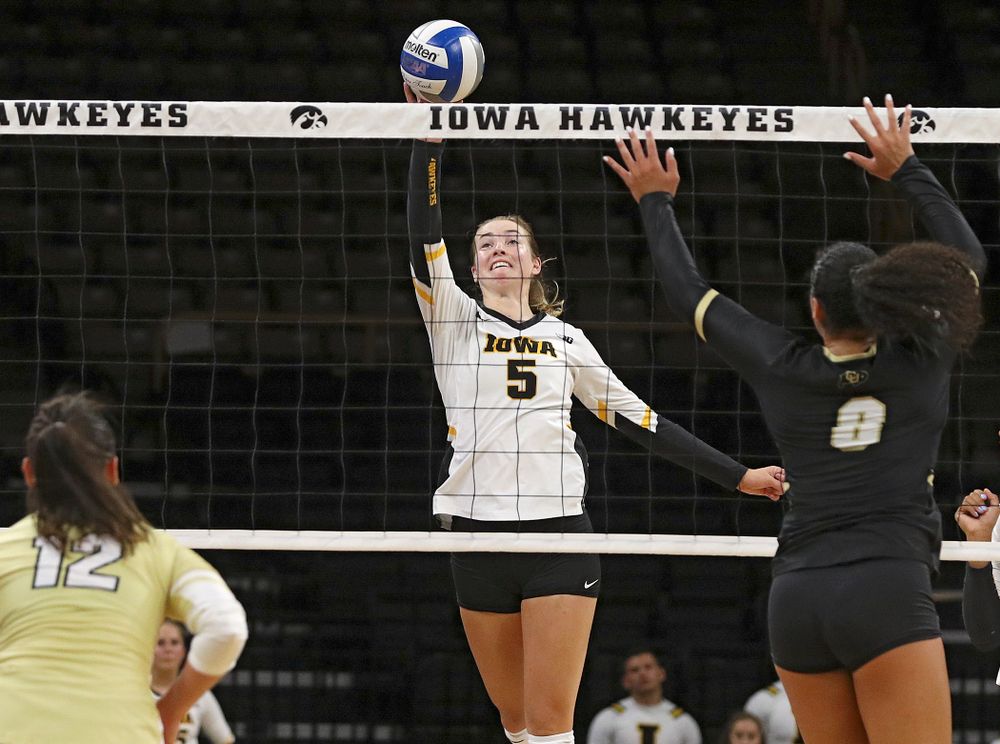 Iowa’s Meghan Buzzerio (5) tips the ball over the net during the third set of their Big Ten/Pac-12 Challenge match against Colorado at Carver-Hawkeye Arena in Iowa City on Friday, Sep 6, 2019. (Stephen Mally/hawkeyesports.com)