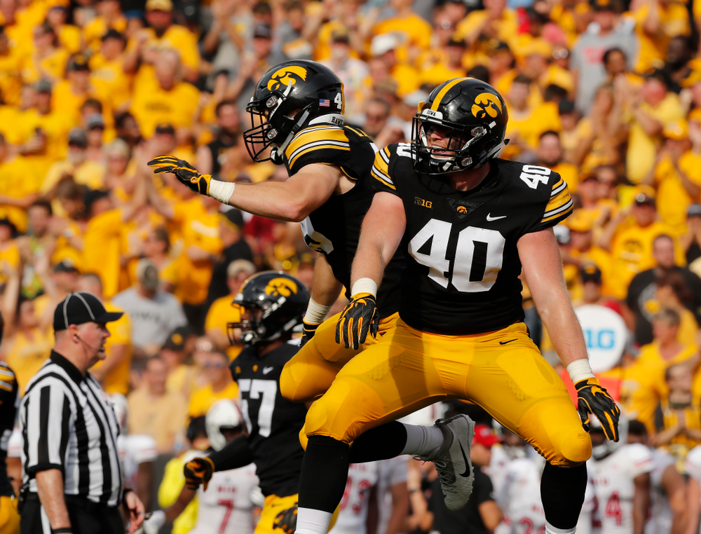 Iowa Hawkeyes defensive end Parker Hesse (40) celebrates a sack with linebacker Nick Niemann (49) against the Northern Illinois Huskies Saturday, September 1, 2018 at Kinnick Stadium. (Brian Ray/hawkeyesports.com)