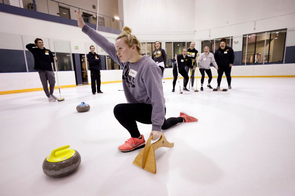 Members of the Iowa Softball team learn the sport of curling as part of a team building event Wednesday, January 10, 2018 at the Cedar Rapids Ice Arena. (Brian Ray/hawkeyesports.com)