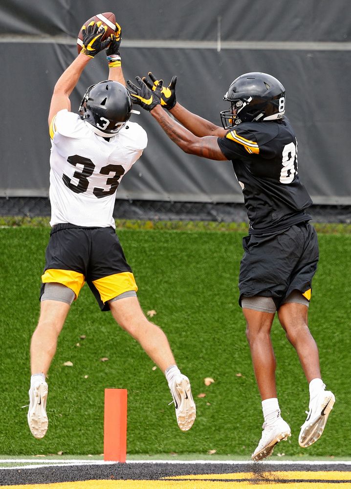 Iowa Hawkeyes defensive back Riley Moss (33) intercepts a pass intended for wide receiver Desmond Hutson (81) during Fall Camp Practice No. 15 at the Hansen Football Performance Center in Iowa City on Monday, Aug 19, 2019. (Stephen Mally/hawkeyesports.com)