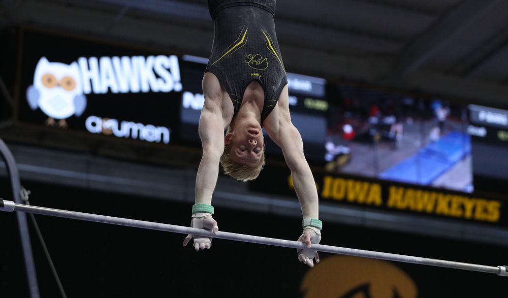 Iowa's Nick Merryman competes on the high bar against the Ohio State Buckeyes Saturday, March 16, 2019 at Carver-Hawkeye Arena. (Brian Ray/hawkeyesports.com)