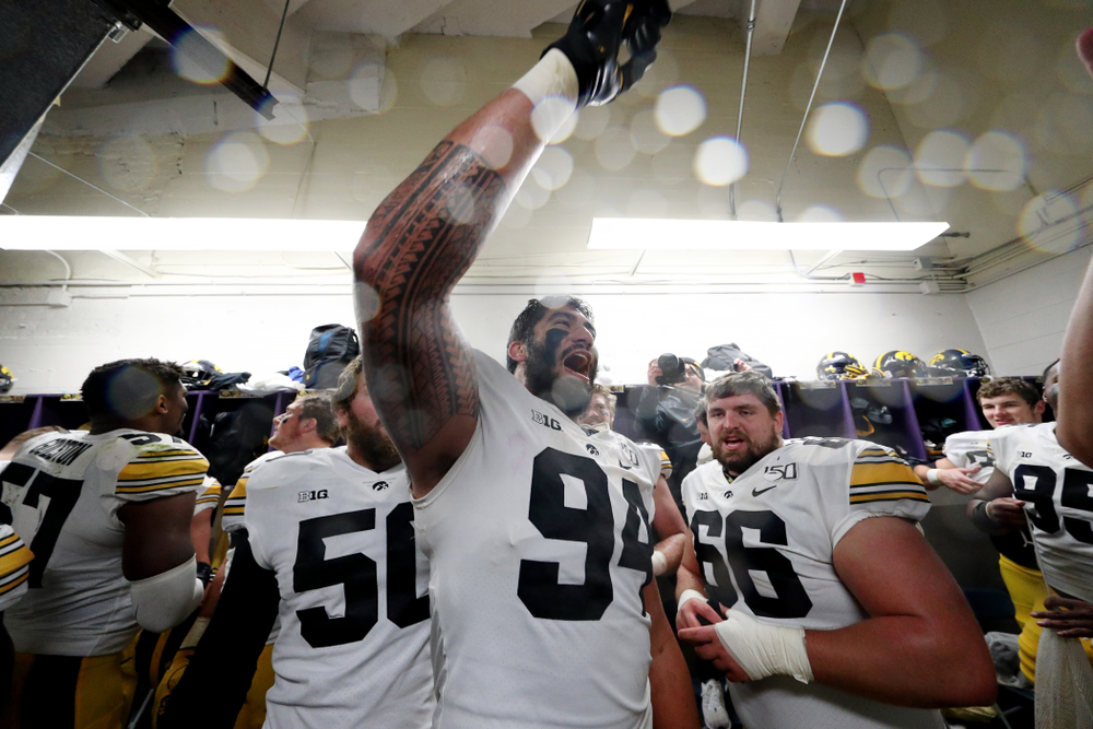 Iowa Hawkeyes defensive end A.J. Epenesa (94) celebrates their victory against the Northwestern Wildcats Saturday, October 26, 2019 at Ryan Field in Evanston, Ill. (Brian Ray/hawkeyesports.com)