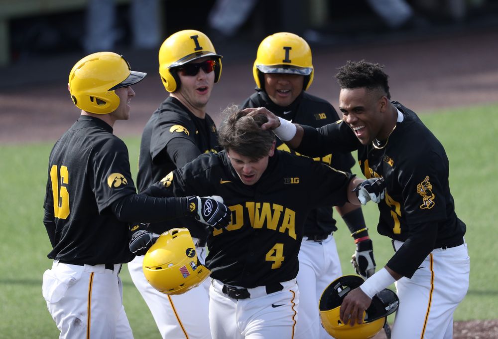 Iowa Hawkeyes infielder Mitchell Boe (4) reacts after hitting a game tying three-run homer against California State Northridge Sunday, March 17, 2019 at Duane Banks Field. (Brian Ray/hawkeyesports.com)