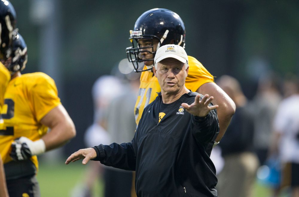 Iowa Hawkeyes Defensive Line coach Reese Morgan runs a drill during the team's fourth practice of camp Thursday, Aug. 7, 2014 at the Hayden Fry Football Complex in Iowa City. (Brian Ray/hawkeyesports.com)