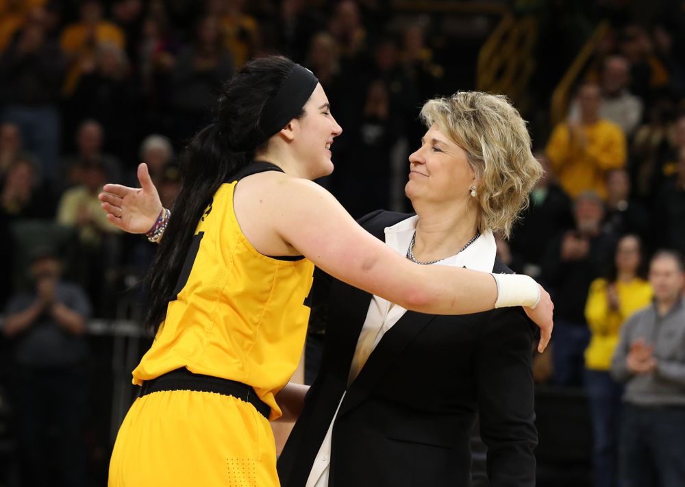 Iowa Hawkeyes forward Megan Gustafson (10) and head coach Lisa Bluder during senior day ceremonies following their game against the Northwestern Wildcats Sunday, March 3, 2019 at Carver-Hawkeye Arena. (Brian Ray/hawkeyesports.com)