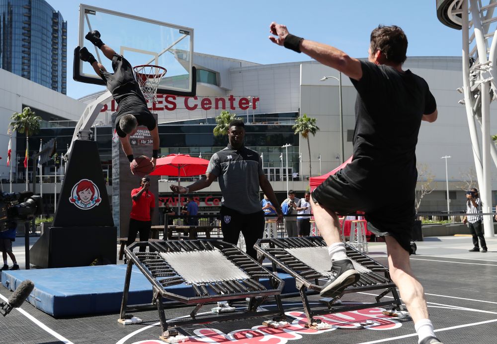 Iowa Hawkeyes forward Megan Gustafson (10) judges dunks with DukeÕs Zion Williamson during a Special Olympics event Friday, April 12, 2019 as part of the ESPN College Basketball Awards in the XBOX Plaza at LA Live. (Brian Ray/hawkeyesports.com)