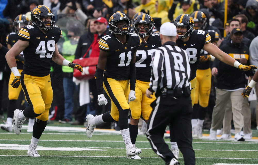 Iowa Hawkeyes defensive back Michael Ojemudia (11) celebrates after making an interception during a game against Nebraska at Kinnick Stadium on November 23, 2018. (Tork Mason/hawkeyesports.com)