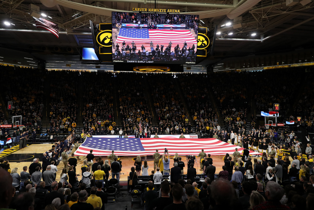 Members of the Iowa Army ROTC display a large American flag before the Iowa Hawkeyes game against Penn State Saturday, February 29, 2020 at Carver-Hawkeye Arena. (Brian Ray/hawkeyesports.com)