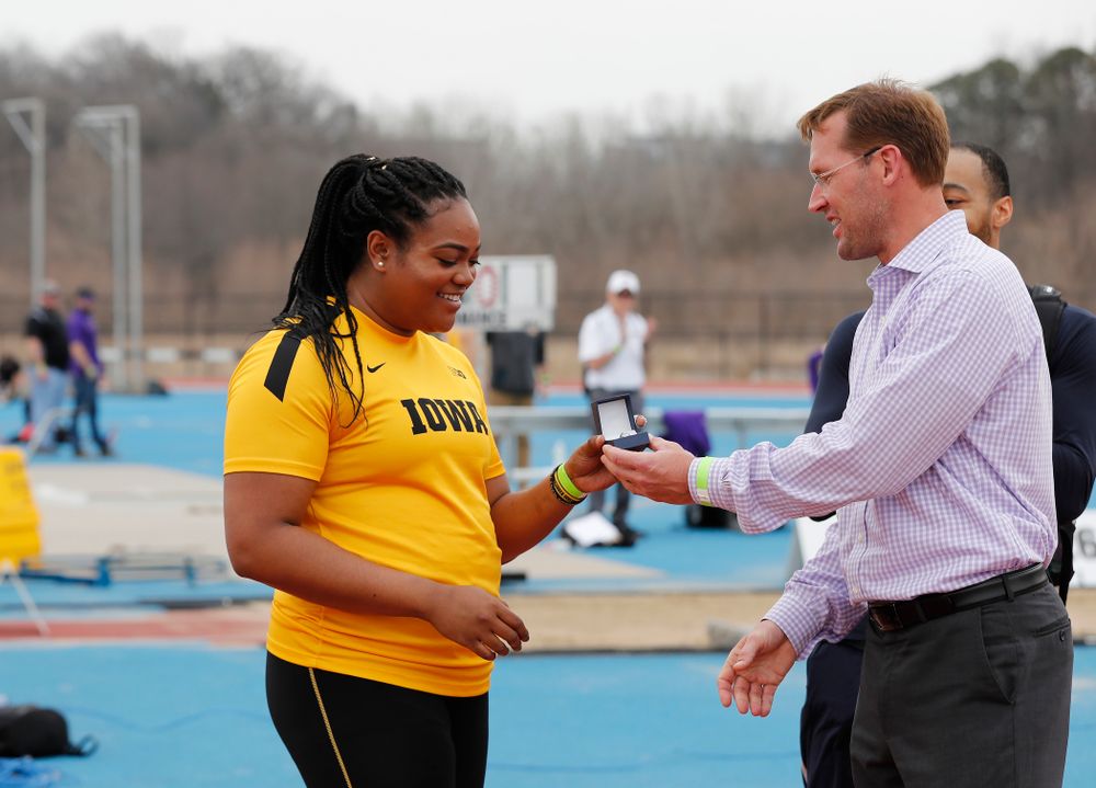 Iowa's Laulauga Tausaga and Aaron Mallett receive their Big Ten Championship rings during the 2018 MUSCO Twilight Invitational Thursday, April 12, 2018 at the Cretzmeyer Track. (Brian Ray/hawkeyesports.com)