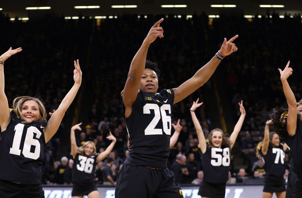 The Iowa Dance Team performs with the Iowa Football Team at halftime of the Iowa Hawkeyes game against the Indiana Hoosiers Friday, February 22, 2019 at Carver-Hawkeye Arena. (Brian Ray/hawkeyesports.com)