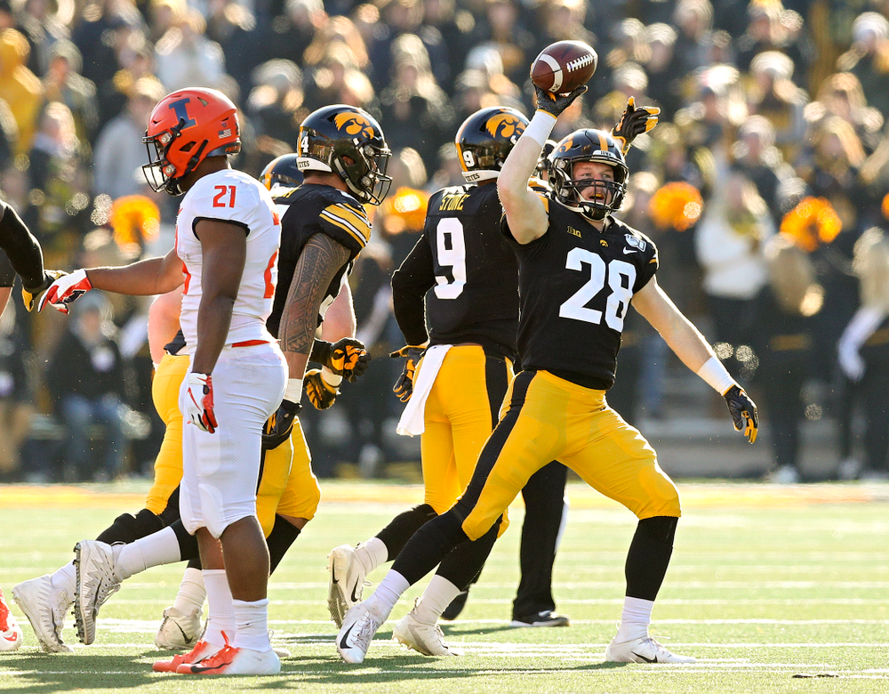 Iowa Hawkeyes defensive back Jack Koerner (28) holds up the ball after he recovered a fumble during the fourth quarter of their game at Kinnick Stadium in Iowa City on Saturday, Nov 23, 2019. (Stephen Mally/hawkeyesports.com)