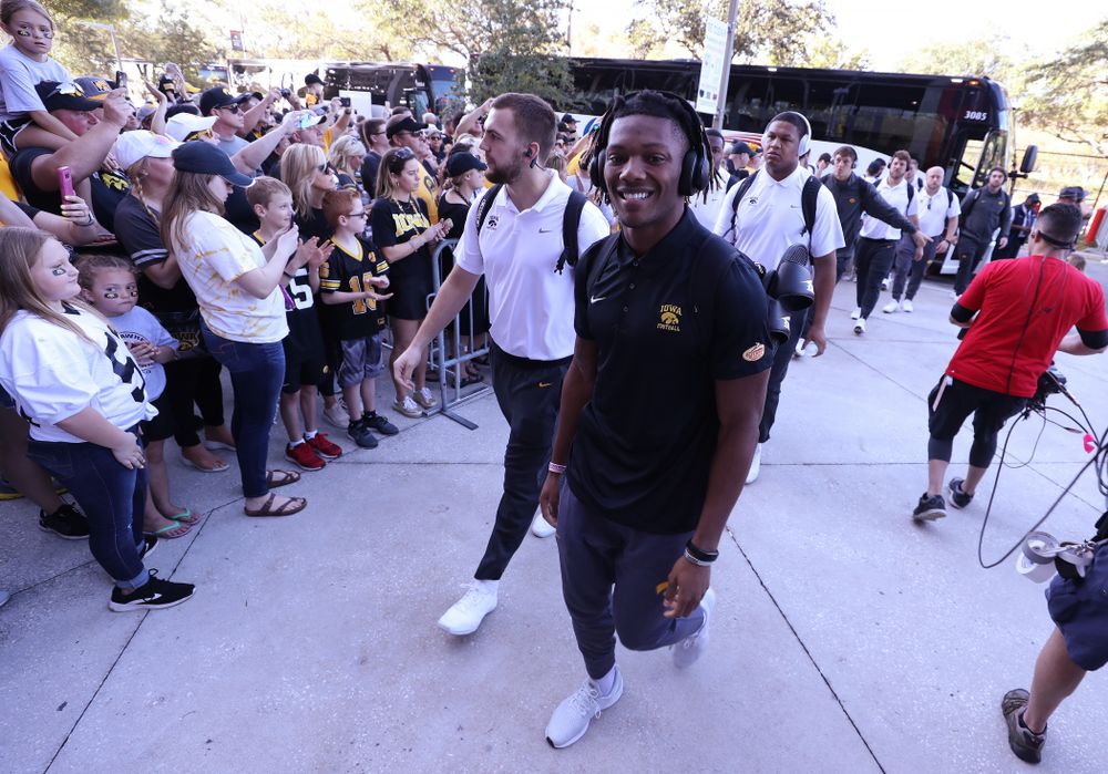 Iowa Hawkeyes wide receiver Brandon Smith (12) smiles as he arrives for the Outback Bowl Tuesday, January 1, 2019 at Raymond James Stadium in Tampa, FL. (Brian Ray/hawkeyesports.com)