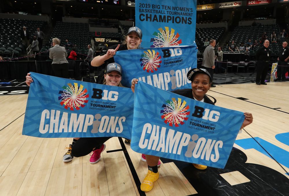 Iowa Hawkeyes guard Kathleen Doyle (22), guard Makenzie Meyer (3), and guard Zion Sanders (24) celebrate their victory over the Maryland Terrapins in the Big Ten Championship Game Sunday, March 10, 2019 at Bankers Life Fieldhouse in Indianapolis, Ind. (Brian Ray/hawkeyesports.com)