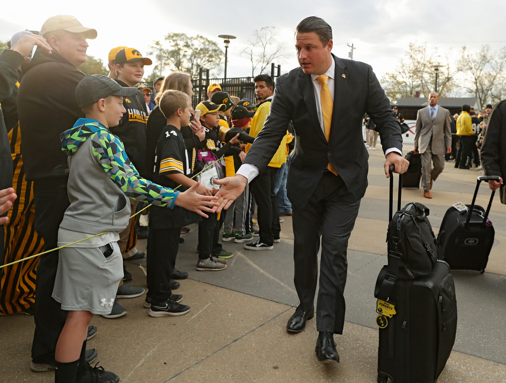 Iowa Hawkeyes offensive coordinator Brian Ferentz greets fans as he arrives with his team before their game at Kinnick Stadium in Iowa City on Saturday, Oct 19, 2019. (Stephen Mally/hawkeyesports.com)